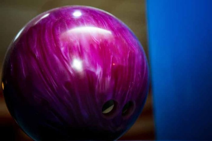 The mass of bowling ball is 7.25